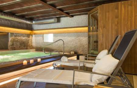 Can Barracas, a detail of the spa, with heated pool, Jacuzzi, sauna, and steam shower