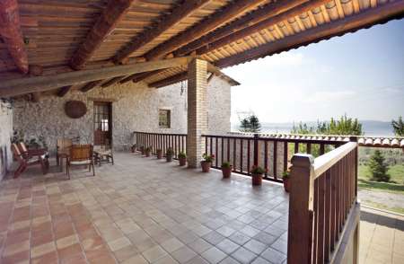 Can Rovira, the huge balcony over the patio behind the house